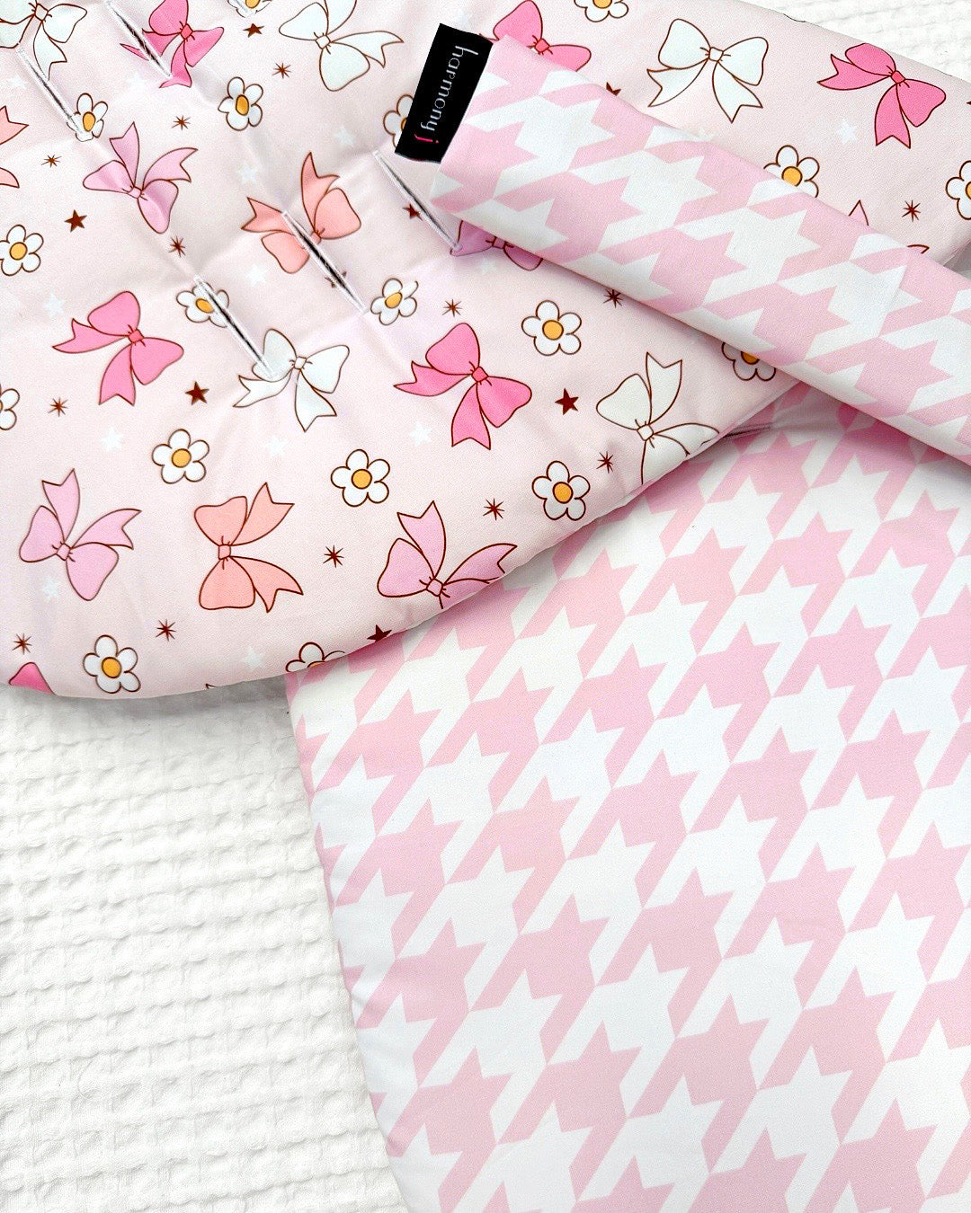 Pretty girl pram liner using houndsooth pink and pretty bows by harmony j.