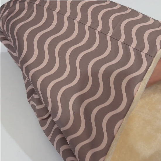 Waves Earth warm pram footmuff to keep your baby warm in winter and the cooler days.