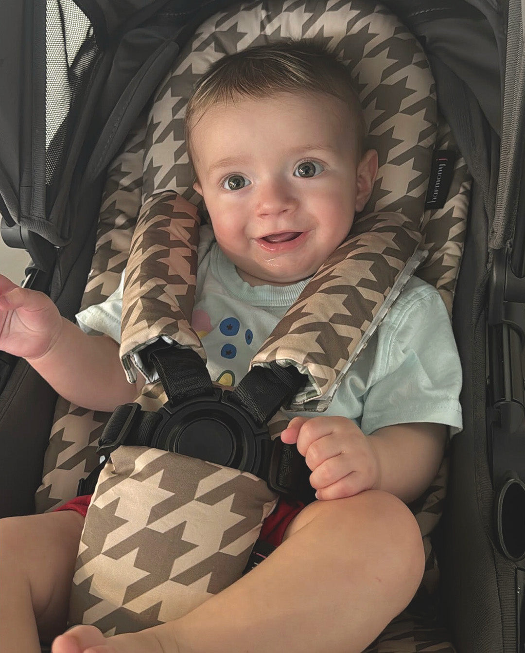 little boy with his Houndstooth Earth Pram Liner and accessories. Made for the Milly + Coup Leo pram by harmony j.