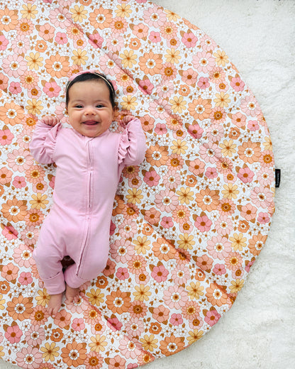 A gorgeous baby girl and her pretty floral custom baby play mat made by harmony j.